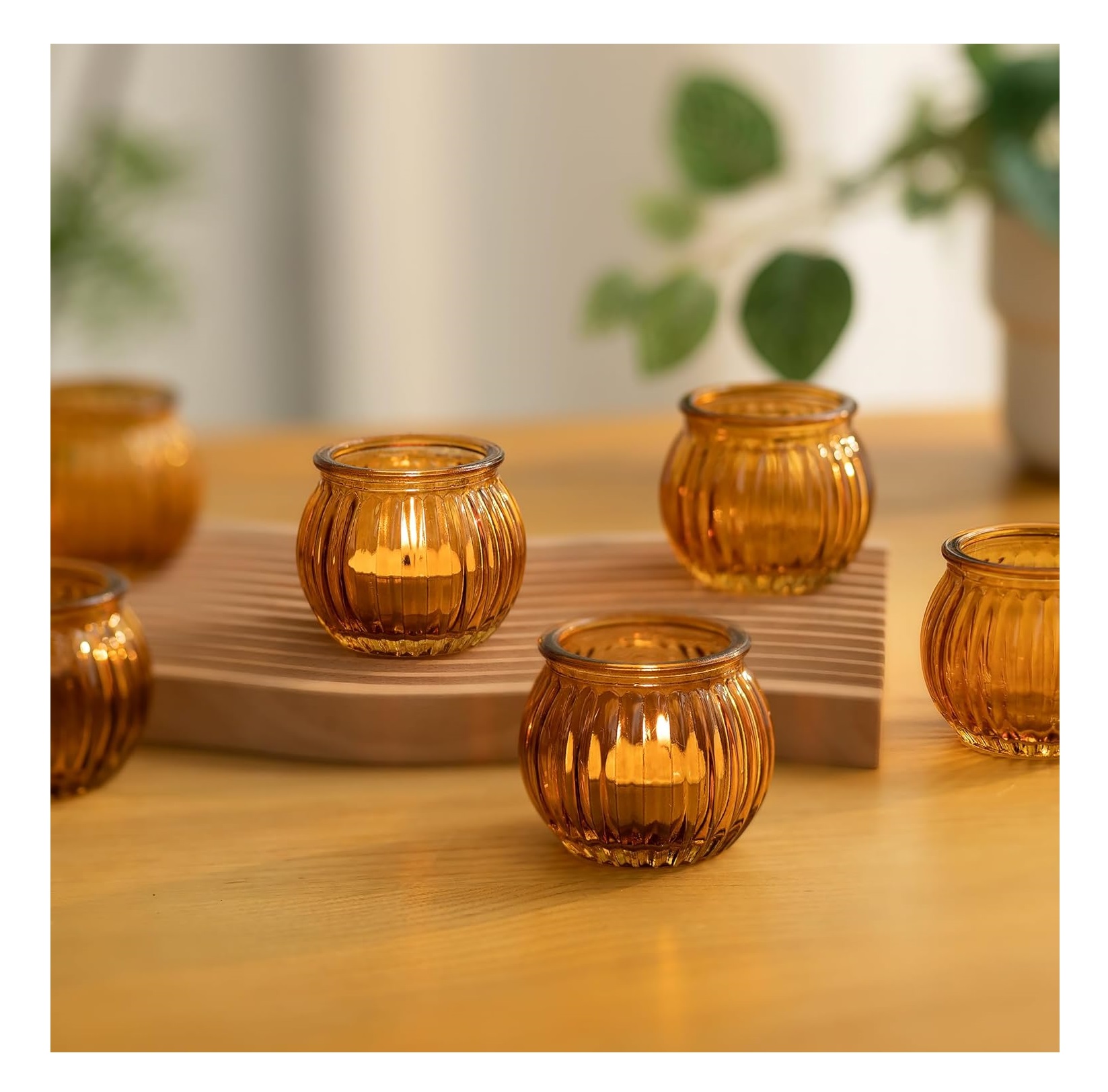 Colourful glass votive candle holders for warm festive home decoration