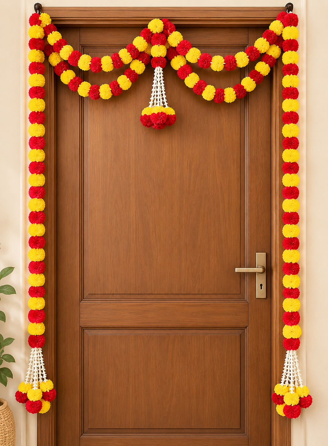 Ganesh Chaturthi doorway decoration with red and yellow flowers and white floral hangings